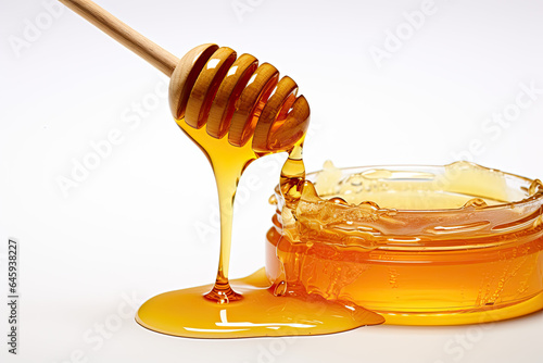 honey dripping from a wooden dipper