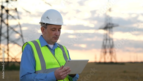 Positive engineer controls process with tablet at power transmission substation