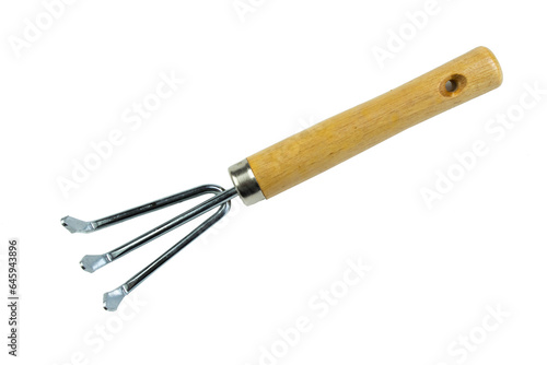 small garden rake isolated on a white background. Tool. Top view.