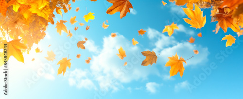 Beautiful fall leaves carried by the wind. Autumn leaves against blue sky with clouds. Banner autumn background. digital ai