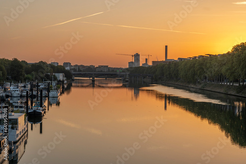 Gennevilliers, France - 05 06 2023: Panoramic view of the Seine river and Saint-Denis district from Clichy bridge at sunrise.
