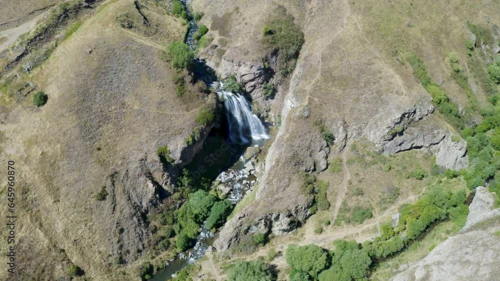 Orbital aerial shot of Trchkan Waterfall on sunny summer day. Shirak Province, Armenia. Orbital aerial shot of Trchkan Waterfall on sunny summer day. Shirak Province, Armenia.