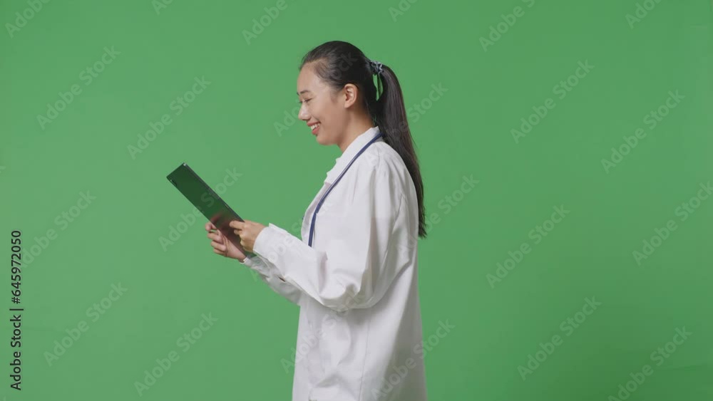 Side View Of Asian Female Doctor With Stethoscope Using A Tablet While Walking On Green Screen Background In The Hospital
Side View Of Asian Female Doctor With Stethoscope Using A Tablet While Walking On Green Screen Background In The Hospital