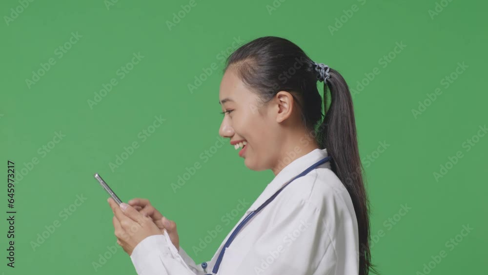 Close Up Of Side View Asian Female Doctor With Stethoscope Using Smartphone While Walking On Green Screen Background In The Hospital
Close Up Of Side View Asian Female Doctor With Stethoscope Using Smartphone While Walking On Green Screen Background In The Hospital