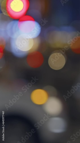 Manhattan street at night, colorful lights, pedestrians and vehicles, vertical reels