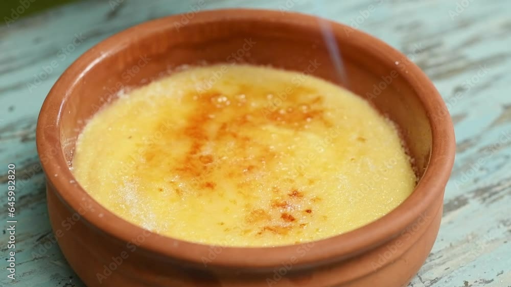 Caramelizing sugar on the Crema Catalana with a gas burner.
Caramelizing sugar on the Crema Catalana with a gas burner.