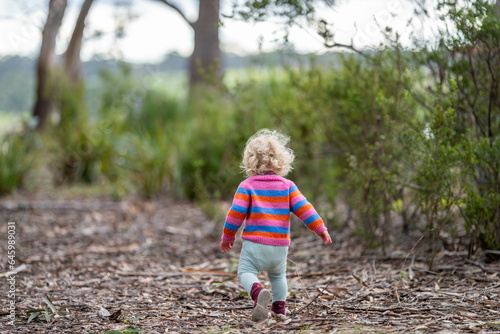toddler exploring in natural in the forest © William