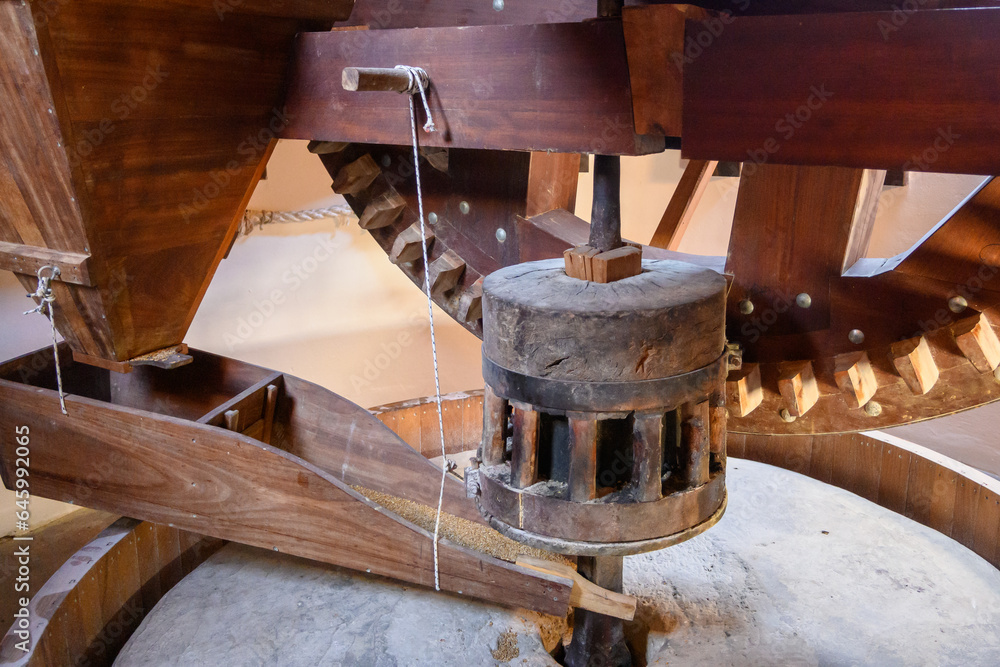 The original, wooden mechanism of an old Greek windmill, grain mill The original, wooden mechanism of an old Greek windmill, grain mill