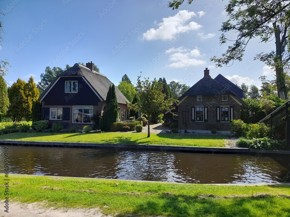 Giethoorn, Netherlands: A picturesque village of tranquil waterways and charming thatched-roof cottages.
