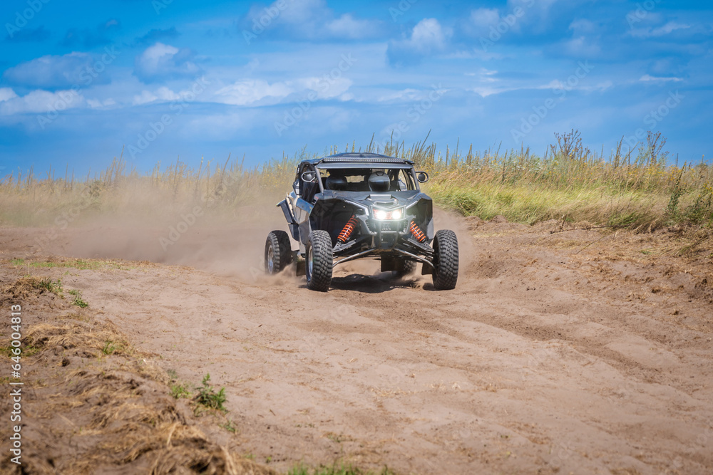 UTV buggy and 4x4 off road vehicle in sandy track. Buggy extreme riding UTV buggy and 4x4 off road vehicle in sandy track. Buggy extreme riding
