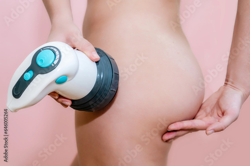 Close up of female buttocks with wireless massager