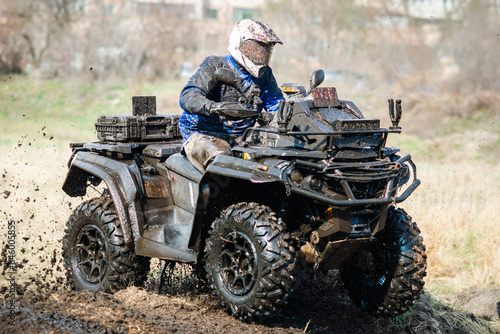 ATV, UTV, buggy, 4x4 off-road vehicle in muddy water. Extreme, adrenalin