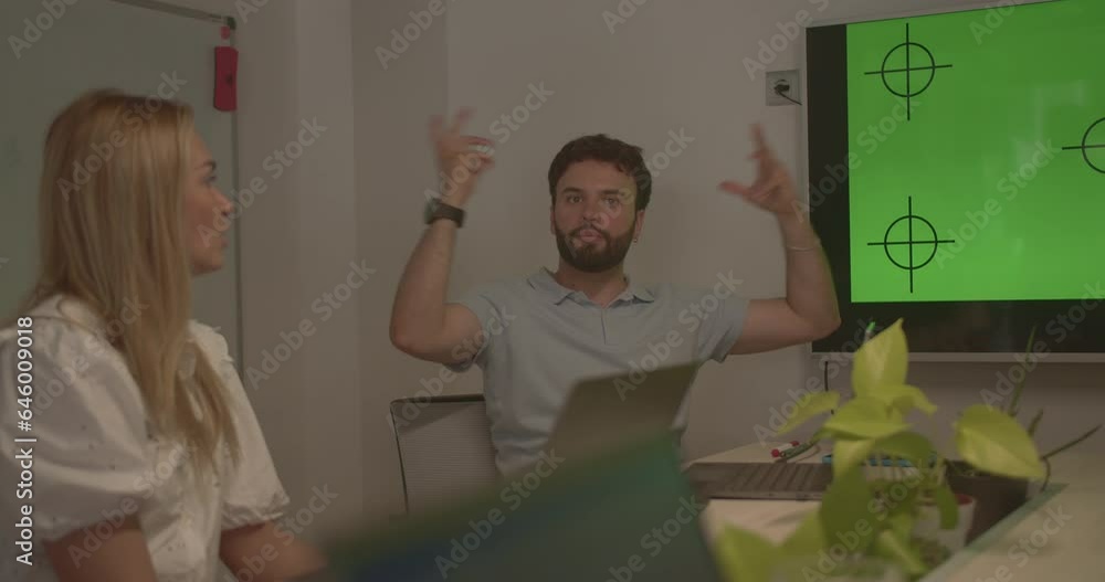TV set with green screen with tracking markers on a meeting room with