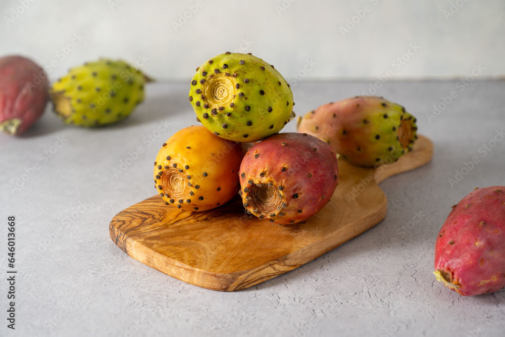 Prickly pears, exotic cactus fruits, grey background. 