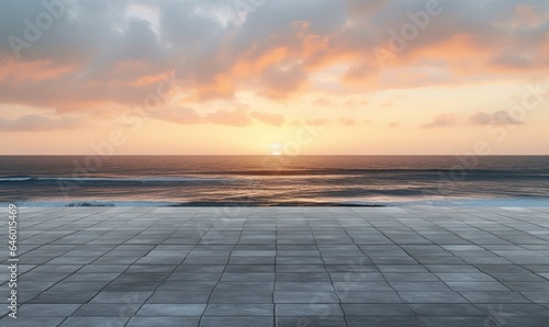 Empty concrete floor against the backdrop of the ocean at sunset.