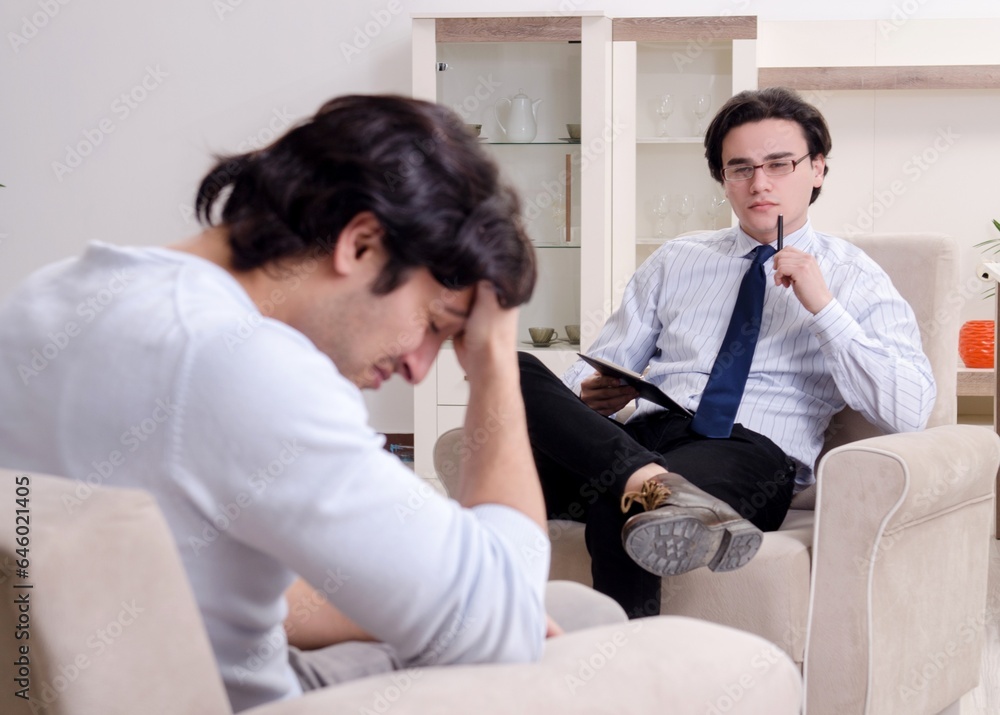 Young male patient discussing with psychologist personal problem Young male patient discussing with psychologist personal problem