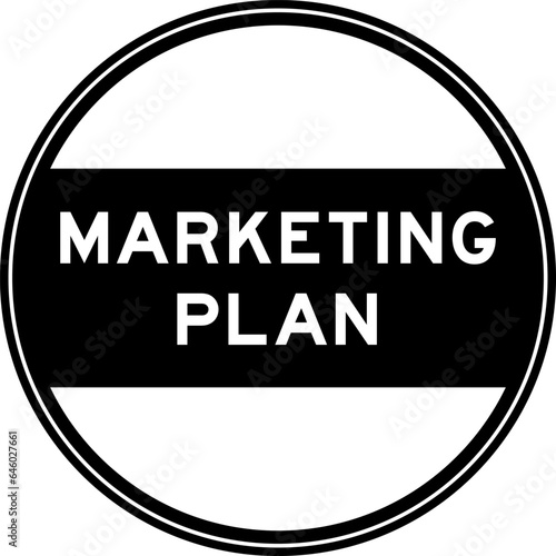 Black color round seal sticker in word marketing plan on white background