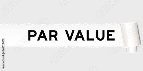 Ripped gray paper background that have word par value under torn part