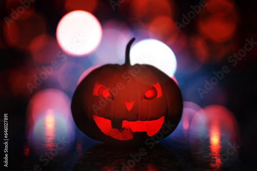 Halloween holiday concept. A pumpkin with a carved, scary face. Halloween pumpkin head jack o lantern with burning fire background 3D render.