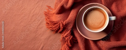 Top view of cappuccino coffee with brown fabric on a textured background. Empty space for placing advertising text on the background. Cafe and bar, barista art concept. Long banner.