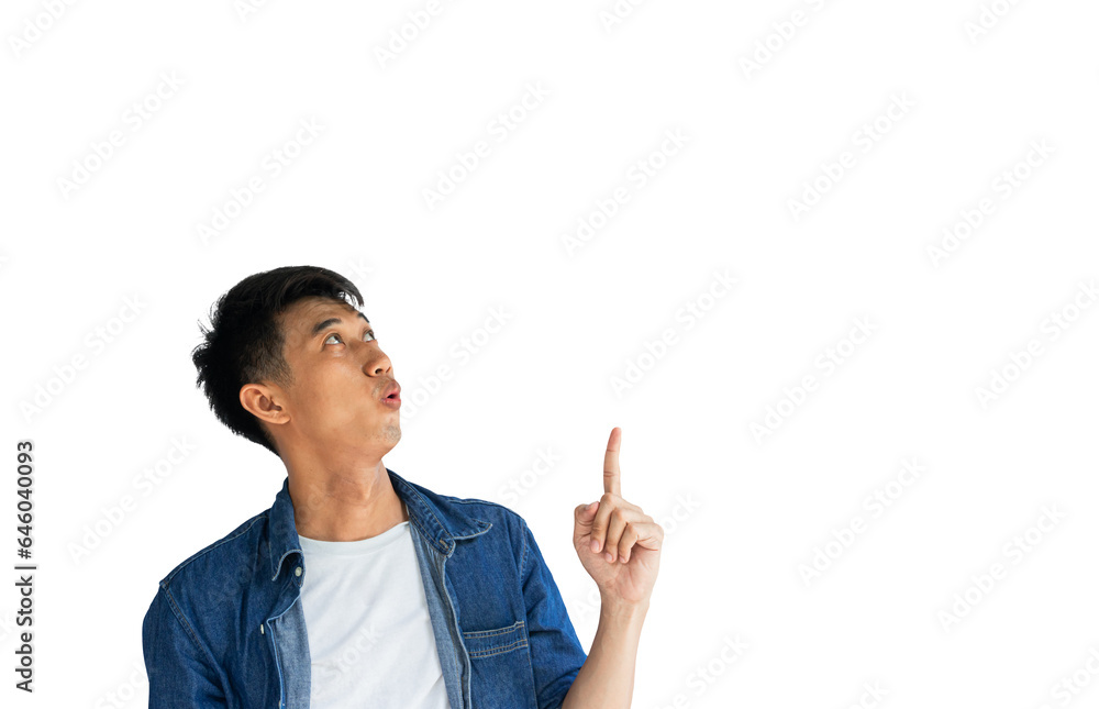 Shocked face of young Asian man wearing blue jeans shirt isolated on white background. Person's index finger pointing to blank space for text. Clipping Path Shocked face of young Asian man wearing blue jeans shirt isolated on white background. Person's index finger pointing to blank space for text. Clipping Path