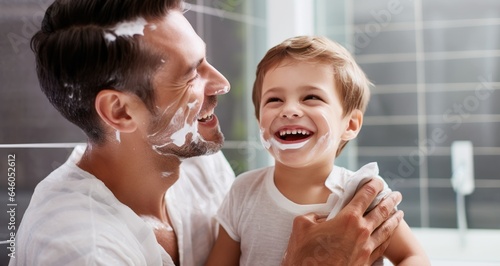 Son shaving with father in the bathroom