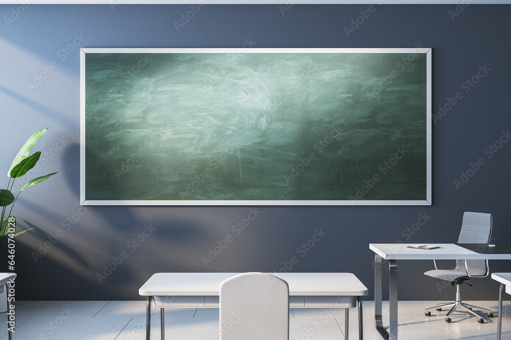 Modern classroom interior with empty mock up chalkboard, white furniture, daylight and equipment. Education, knowledge and workspace concept. 3D Rendering.