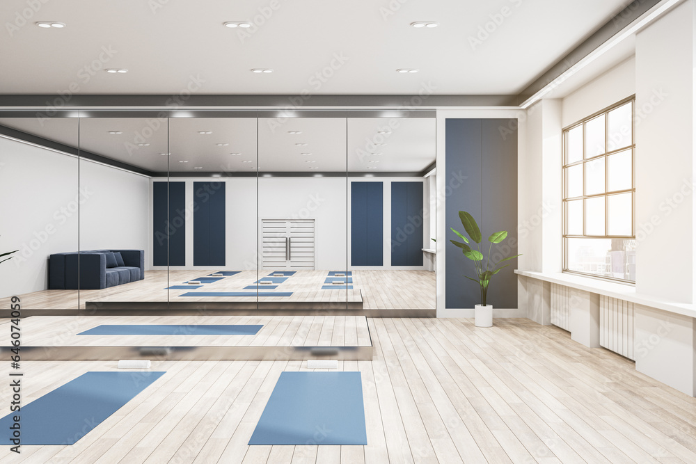 Fototapeta premium Bright group class in gym interior with blue yoga mats, wooden flooring, mirror with reflections, window with city view and daylight. 3D Rendering.