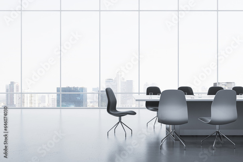 Modern meeting room interior with reflections on concrete flooring and panoramic window with city view and daylight. Commercial office concept. 3D Rendering.