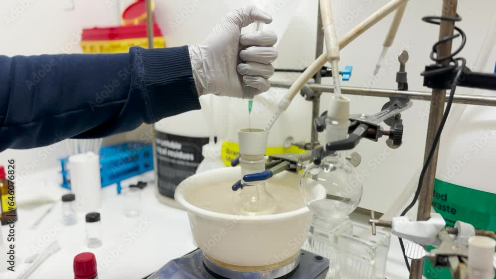 Advance synthesis of chemical compound in a small sealed glass vial and round bottom flask for chemical reaction. Biochemical research on drug development in 4K Advance synthesis of chemical compound in a small sealed glass vial and round bottom flask for chemical reaction. Biochemical research on drug development in 4K