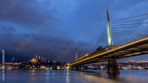 Fototapeta Naklejka Na Ścianę i Meble -  New Halic Metro Bridge at summer night blue sky and city lights in Istanbul, Turkey