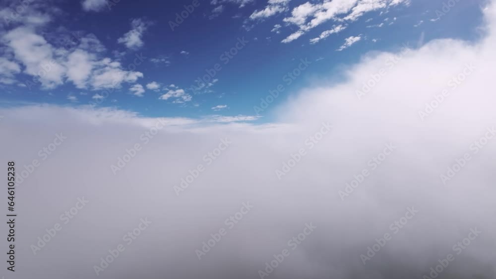 Real flight in the clouds first-person view from the cockpit. Cloud surfing in sunny weather. Aerial view flying through the clouds Real flight in the clouds first-person view from the cockpit. Cloud surfing in sunny weather. Aerial view flying through the clouds