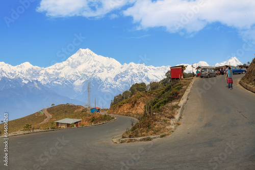 Scenic high altitude mountain road with view of the majestic Kanchenjunga Himalaya range near Tinchuley in Darjeeling district of India