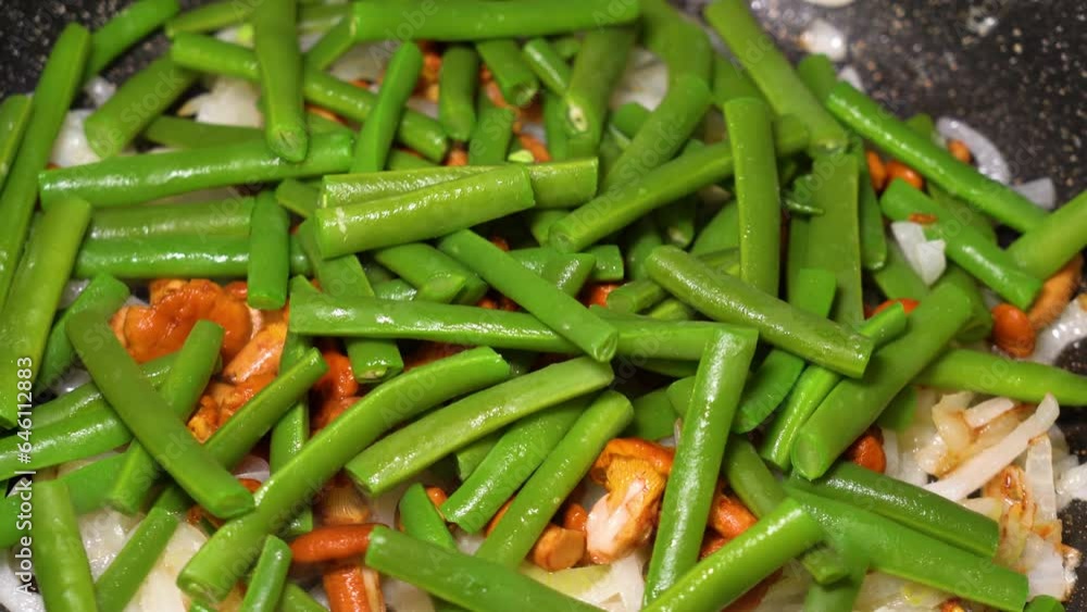 asparagus with mushrooms and vegetables fried in a frying pan asparagus with mushrooms and vegetables fried in a frying pan