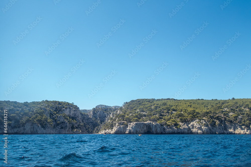 Kayaking to the Calanques fjords on the Mediterranean sea near Cassis in summer Kayaking to the Calanques fjords on the Mediterranean sea near Cassis in summer