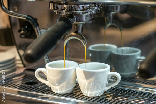 Making two cups of fresh espresso coffee