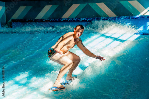 Man on flowboard on blue background photo