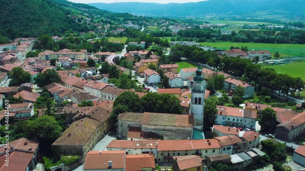 Aerial View of Vipava Town, Slovenia. Red Roofs, Church, Fields and Forest Covered Hills in the Background Aerial View of Vipava Town, Slovenia. Red Roofs, Church, Fields and Forest Covered Hills in the Background