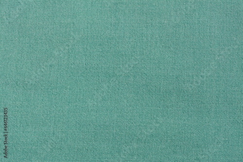 Solid green material made from natural wool. Background