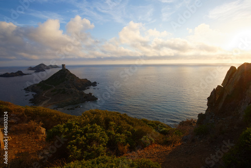 Sunset over popular tourist destination Torra di Parata with Genoese Tower and Archipelago of Sanguinaires islands at background.