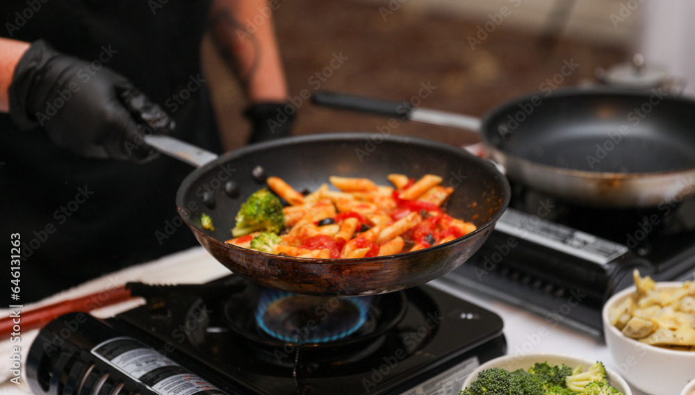 Sizzling culinary artistry in a hot frypan, epitomizing the joy and creativity of home cooking