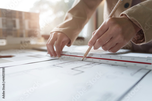 Engineer or interior Architects designer construction plans on blueprint.