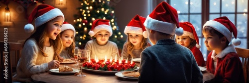 Beautiful happy children having fun celebrating Christmas at home, gathered around the table, having Christmas dinner, enjoying winter holiday season and their time together