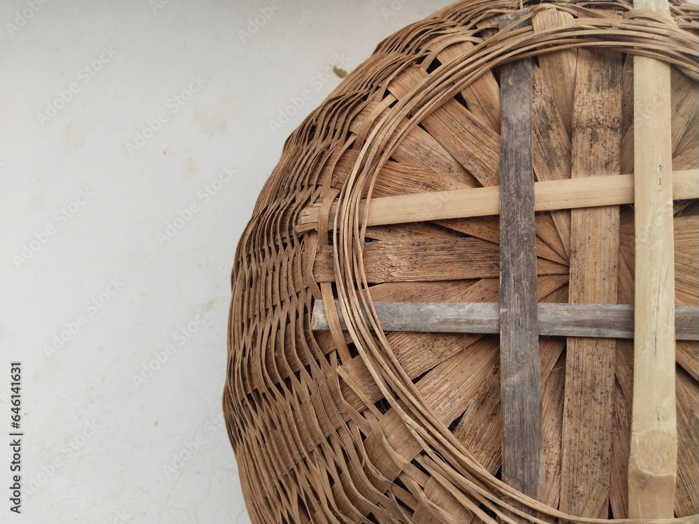 Bamboo basket hand made isolated on white wall background. Woven from
