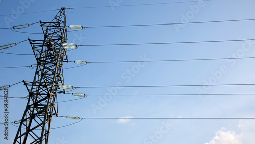 Quadro em tela Electrical tower with voltage transmission wires against the background of blue sky