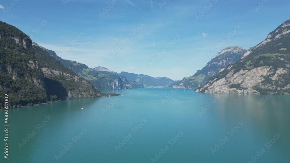 A drone shot of a beautiful lake located in the middle of high mountains. A drone shot of a beautiful lake located in the middle of high mountains.