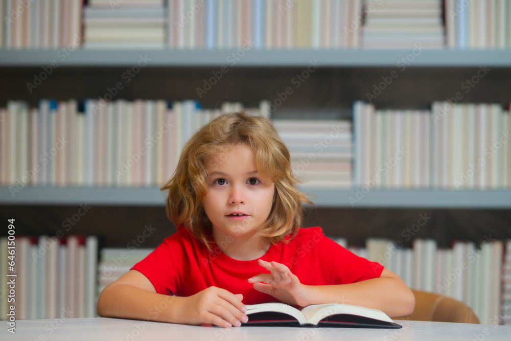 Serious pupil. Little student on school library. Child reading book at school. Nerd pupil studying at school. Clever intelligent schoolboy overwork. Smart child learning to read book. Serious pupil. Little student on school library. Child reading book at school. Nerd pupil studying at school. Clever intelligent schoolboy overwork. Smart child learning to read book.