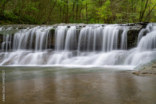 Late afternoon Summer photo of a waterfall in Robert H. Treman State Park near Ithaca NY  Tompkins County New York. 