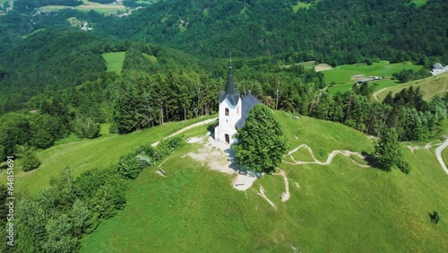 Drone Aerial View Sveti Jakob Church On Top Of Green Hills, Slovenia. photo