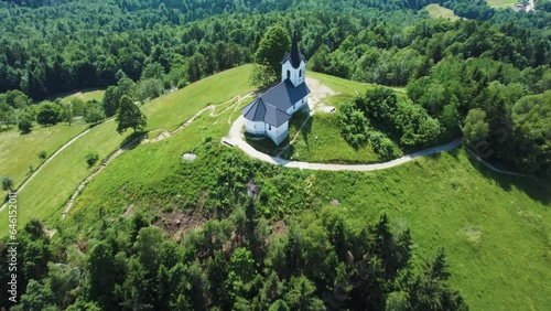 Drone Aerial View Sveti Jakob Church On Top Of Green Hills, Slovenia. photo